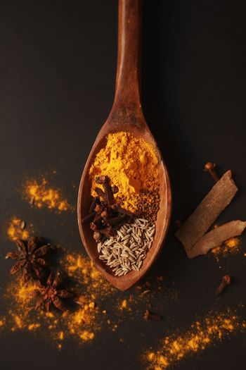 Close-up of spices on wood