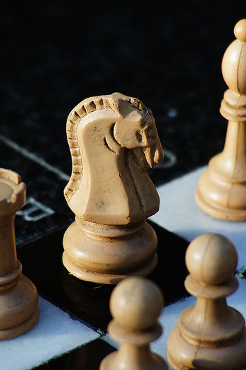High angle view of pieces on chess board