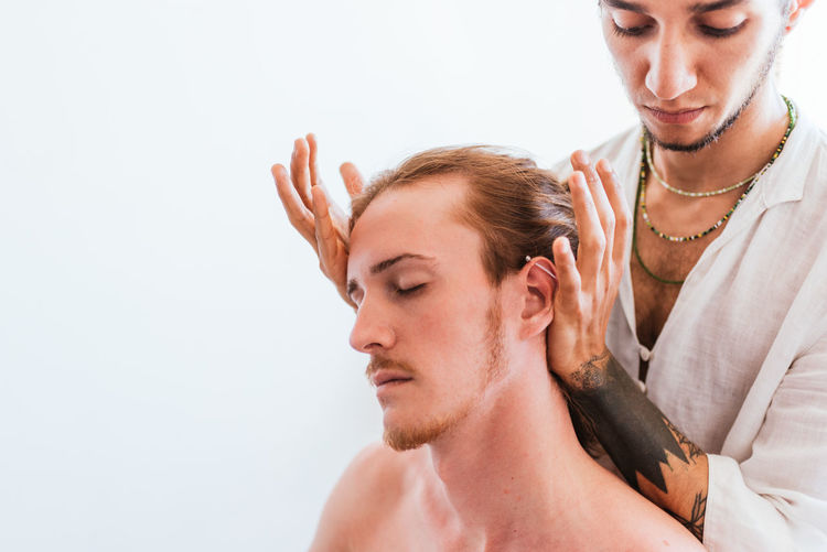 Therapist massaging customer in spa