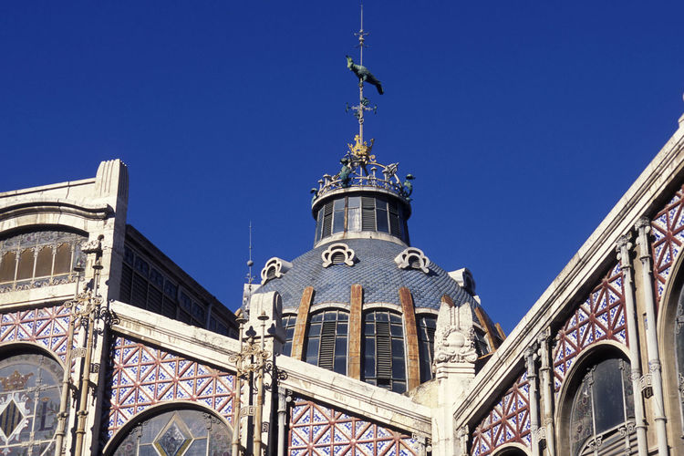 Low angle view of building against blue sky