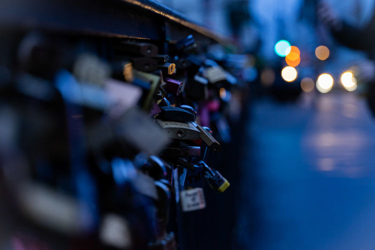 Close-up of love locks on railing