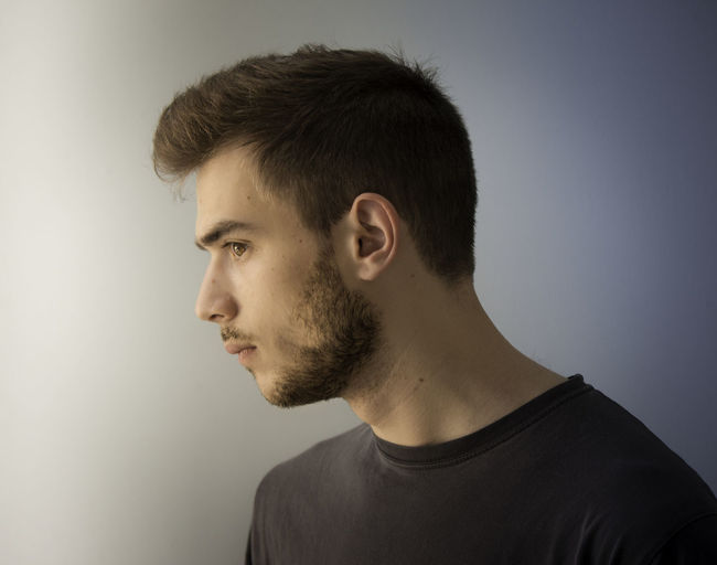 Portrait of young man looking away