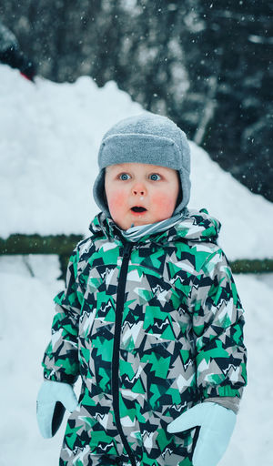 Portrait of cute boy in snow