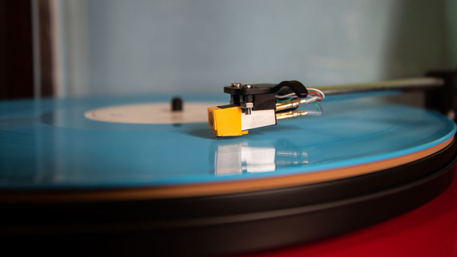 Closeup if a blue lp on a turntable