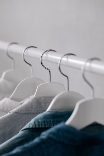 Close-up of clothes hanging on rack