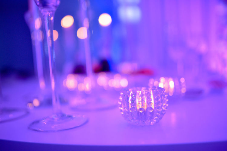 Close-up of illuminated glass on table