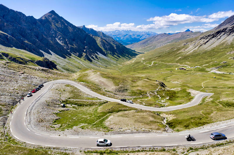 Cars on road against mountain range