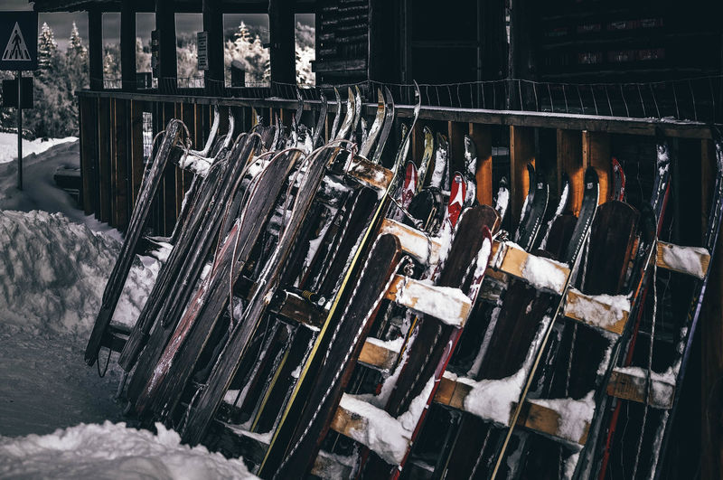 Close-up of clothes hanging in row for sale