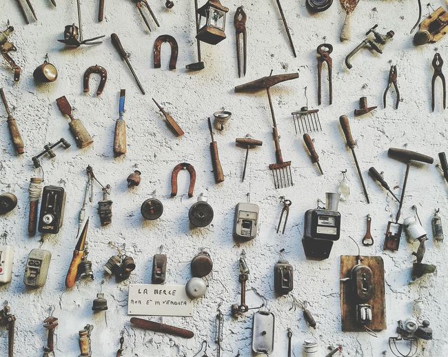Various hand tools hanging on wall