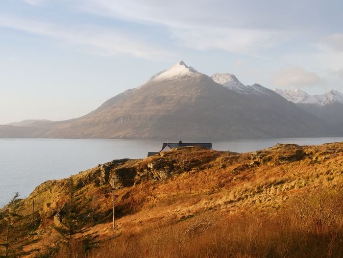 Evening at loch scavaig with cuillins mountains in warm sunset light. isle of skye scotland