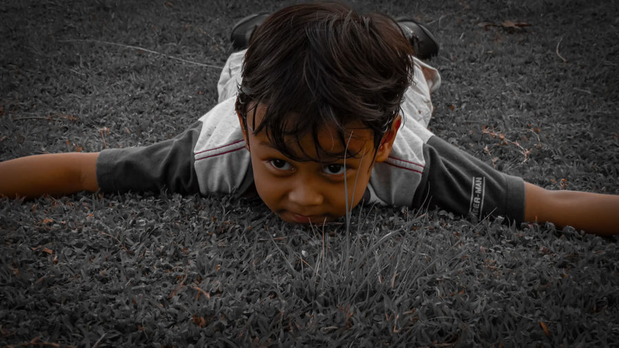 High angle portrait of boy on field