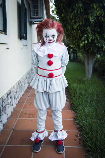 Girl wearing clown costume