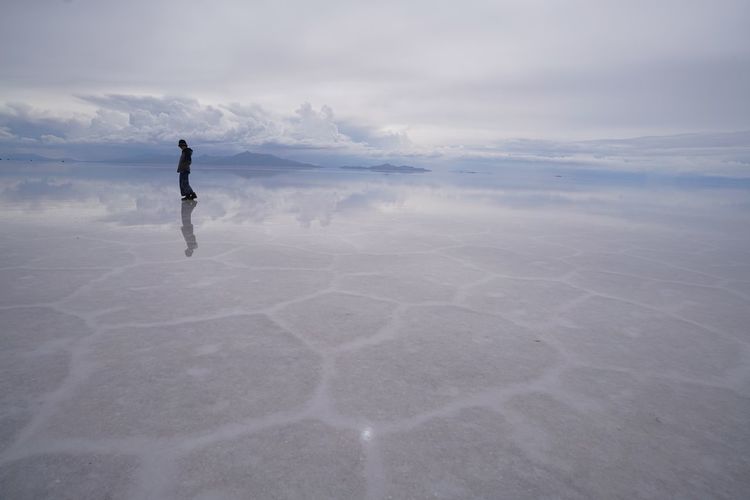 Full length of person walking on land against sky