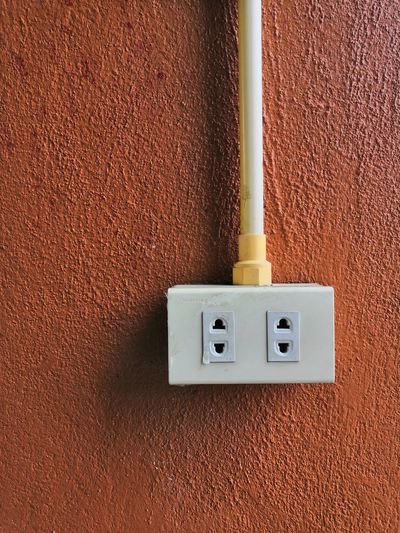 Close-up of outlet on wall