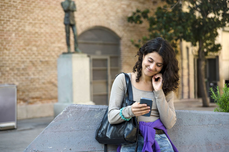 Young woman using mobile phone