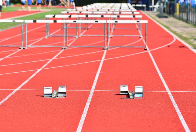 High angle view of hurdles on running track