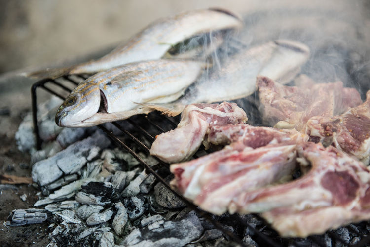 Close-up of dead fish on barbecue grill
