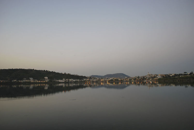 View of calm river against clear sky
