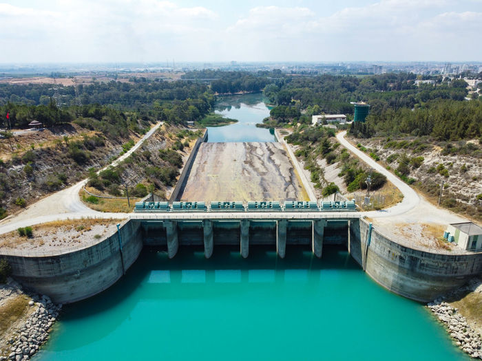 Aerial view of water reservoir, concrete rapid and closed reservoir locks of a dam. berdan dam