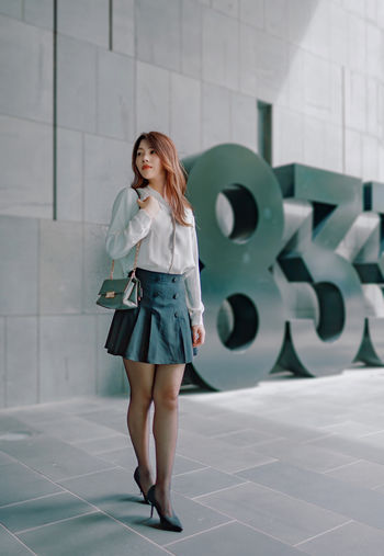 Office girl in cbd under office building 
