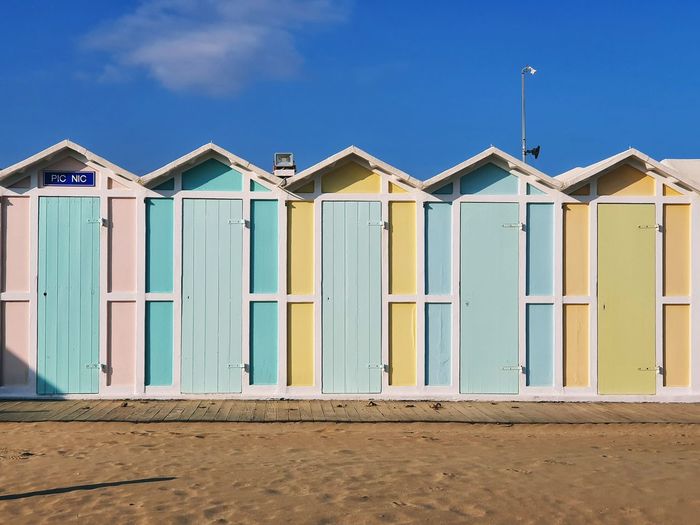 Beach huts against blue sky