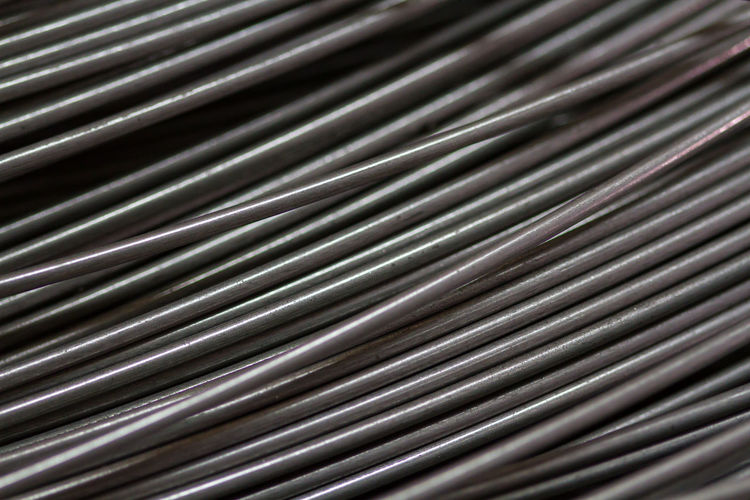 Stainless steel wire in production workshop or construction site. metal texture.