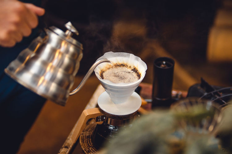 Cropped hand holding coffee