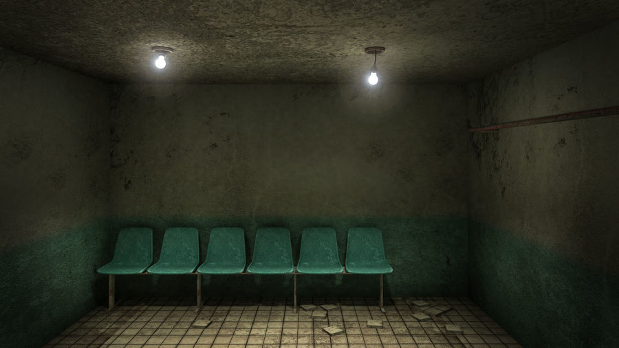 Empty chairs in illuminated room