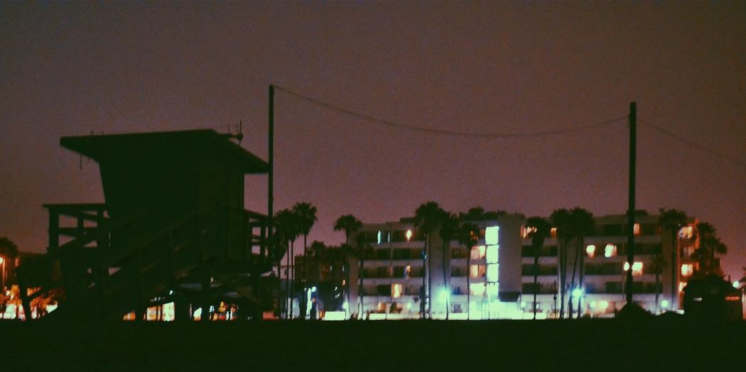 View of illuminated city at sunset