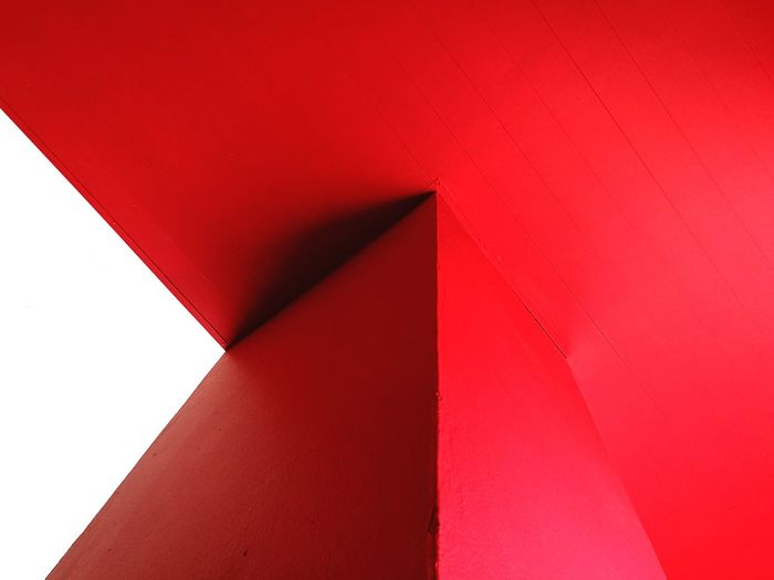 LOW ANGLE VIEW OF RED WALL