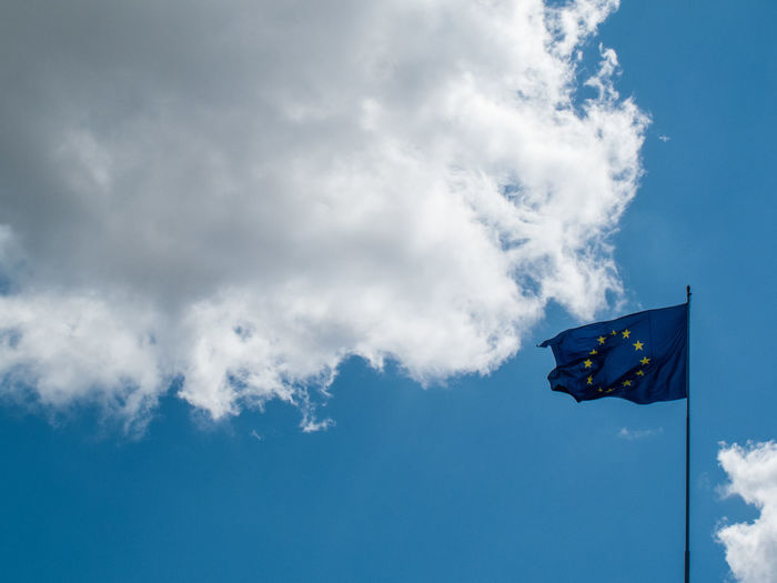 Low angle view of european union flag against sky