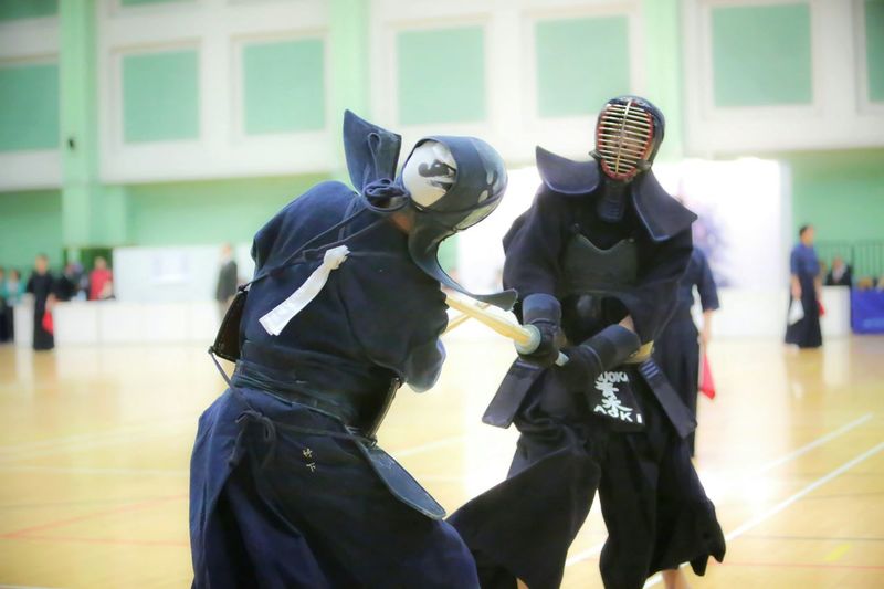 People practicing kendo in court