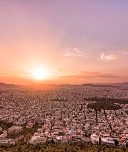 Aerial view of townscape against sky during sunset