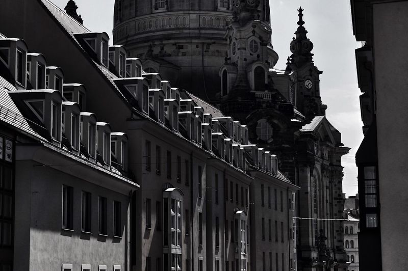 Low angle view of buildings in city against sky