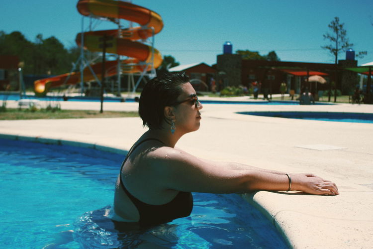Side view of woman in swimming pool