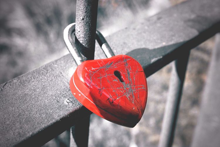 High angle view of love padlock attached to railing