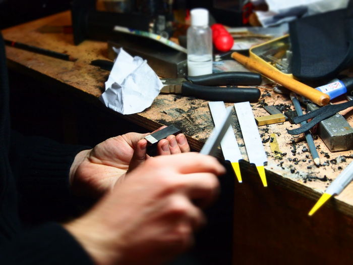 Cropped hands of man working on table