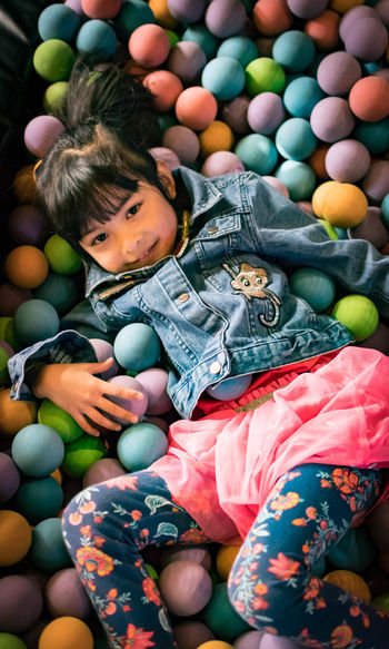 High angle view of girl with toy toys
