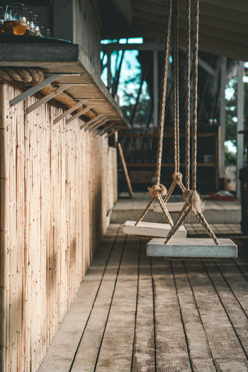 Bar swing with close-up of wooden planks on floor and 