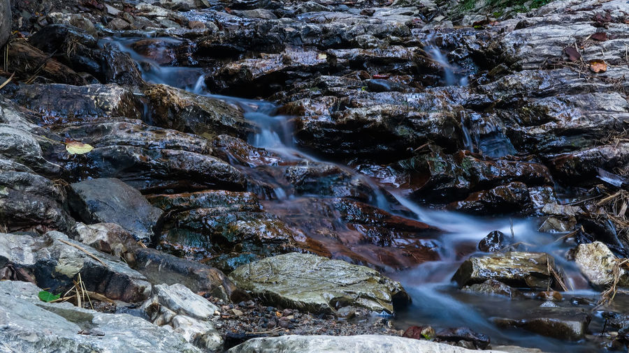 Close up mountain river flows between picturesque summer stones. rocks in the mountains