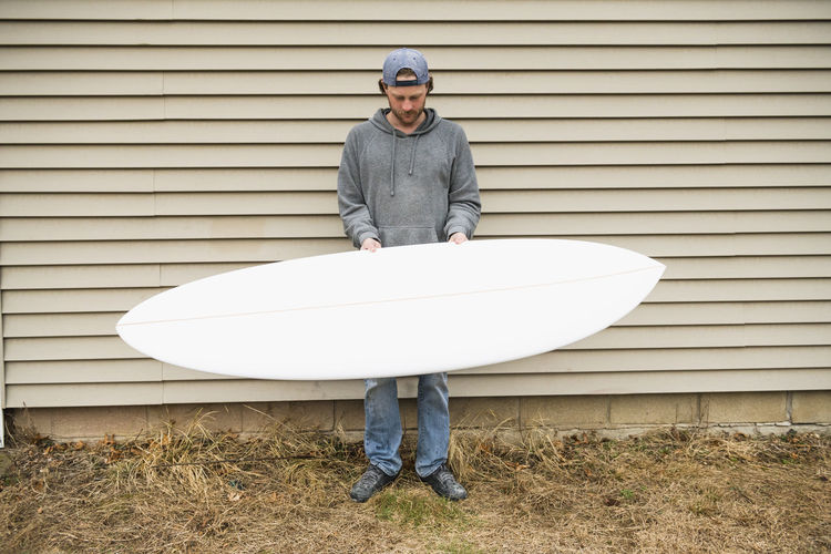 Surfboard shaper refining a new design