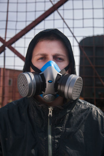Portrait of man wearing gas mask