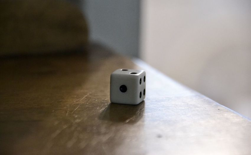 Close-up of a dice on table at home
