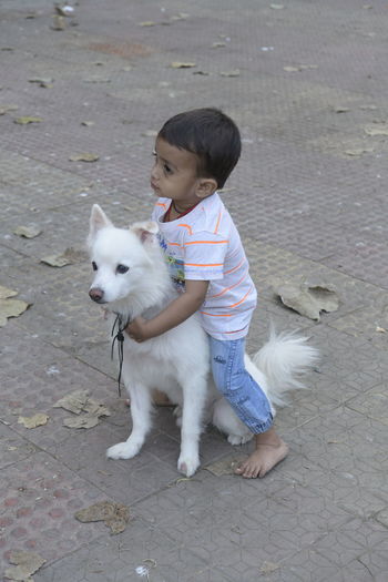Full length of boy with dog