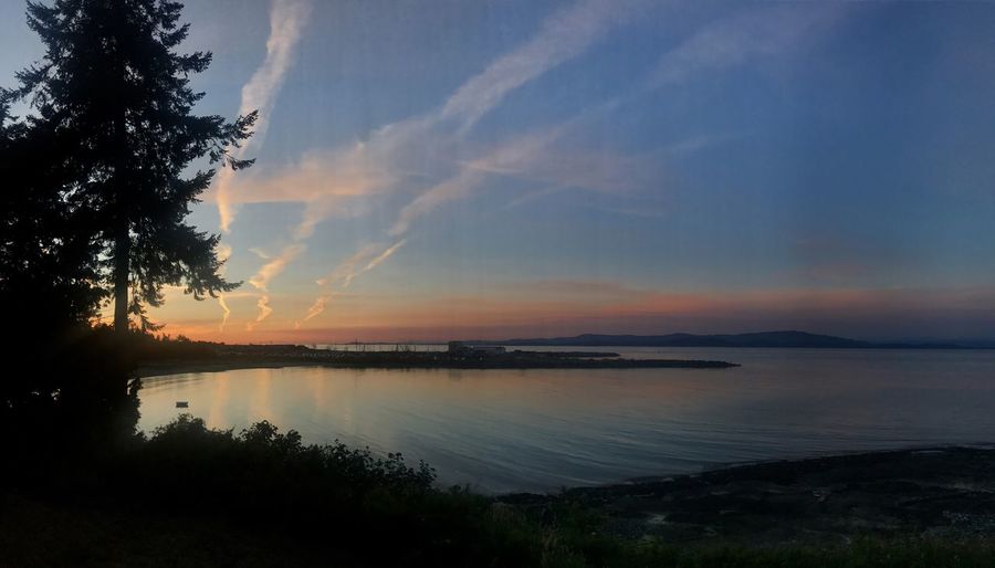 Scenic view of sea against sky at sunset