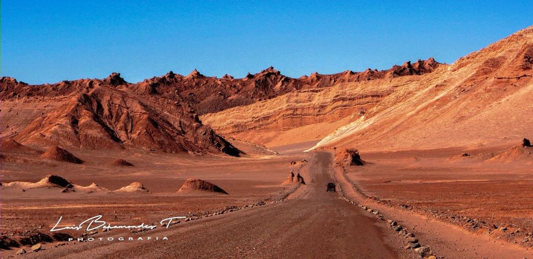 Scenic view of desert against clear sky