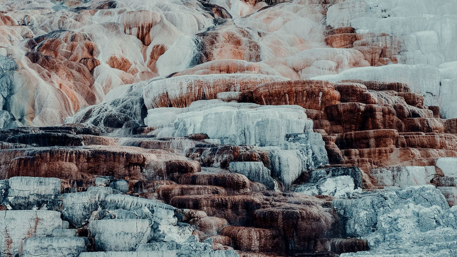 Icicles on rock formation during winter