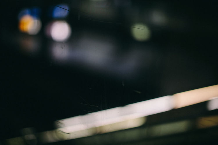 Defocused image of wet car at night