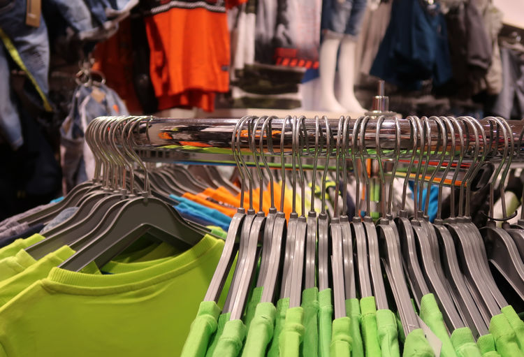Close-up of clothing rack in store