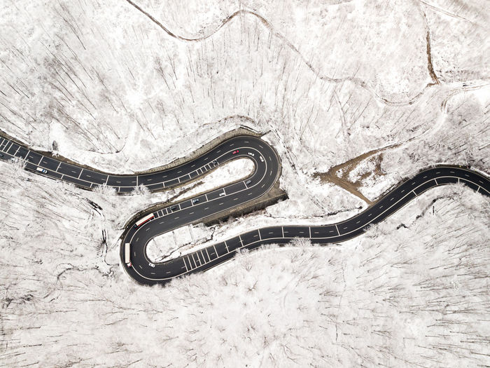 High angle view of cars on snow covered land